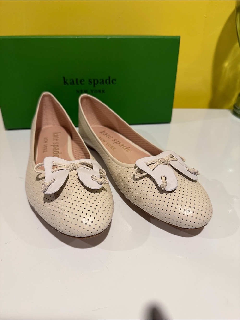 kate spade Cream Perforated Bow Flats
